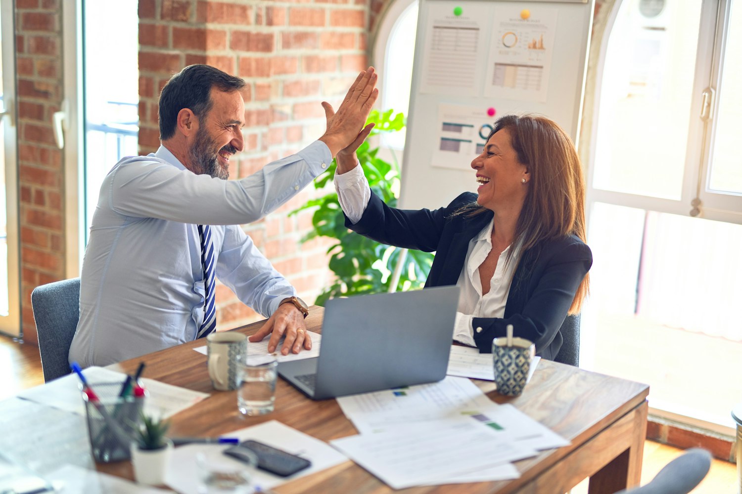 Financial advisors reviewing a wealth plan with clients